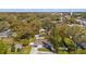 Aerial view of home nestled among mature trees with shed and neighborhood setting at 207 W Patterson St, Tampa, FL 33604