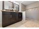 Bathroom features dark wood dual vanity and a modern walk-in shower at 207 W Patterson St, Tampa, FL 33604