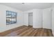 Bright bedroom showcasing hardwood floors and a closet space at 2233 Springwood W Cir, Clearwater, FL 33763