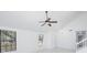 View of the living space featuring tile floors, windows, and a chandelier at 2233 Springwood W Cir, Clearwater, FL 33763