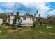Relaxing backyard setting with concrete patio, lush greenery, and ample space at 2501 Auburn S St, St Petersburg, FL 33712