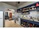 Cozy kitchen connected to the living room, featuring blue cabinets and white appliances at 2501 Auburn S St, St Petersburg, FL 33712