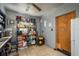 Kitchen featuring open shelving, gray walls, tile floors and access to another room at 2501 Auburn S St, St Petersburg, FL 33712