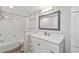 Bathroom featuring a vanity with drawers, a neutral color scheme, and a shower over tub at 2611 Bayshore Blvd # 605, Tampa, FL 33629