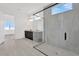 Modern bathroom featuring a glass-enclosed shower and sleek vanity with double sinks at 32347 Wetland Bird Vw, San Antonio, FL 33576