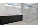 Bathroom features a dual sink vanity and glass-enclosed shower at 32347 Wetland Bird Vw, San Antonio, FL 33576