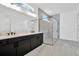 Modern bathroom boasts double vanity and a spacious glass-enclosed shower at 32347 Wetland Bird Vw, San Antonio, FL 33576