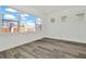 Bedroom featuring wood-look floors and multiple windows for ample light at 32347 Wetland Bird Vw, San Antonio, FL 33576