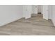 Bedroom showcasing stylish wood-look flooring and bright white trim at 32347 Wetland Bird Vw, San Antonio, FL 33576