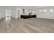 Spacious open-concept kitchen and living area featuring a large island, modern cabinets, and abundant natural light at 32347 Wetland Bird Vw, San Antonio, FL 33576