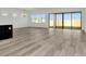 Spacious living area with modern flooring, big windows, and seamless access to outdoor spaces at 32347 Wetland Bird Vw, San Antonio, FL 33576