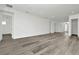 Bright, open-plan living area with hardwood floors and plenty of natural light at 32347 Wetland Bird Vw, San Antonio, FL 33576