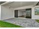 Outdoor patio area with modern flooring that leads into a bright living space at 32347 Wetland Bird Vw, San Antonio, FL 33576
