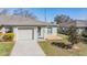 Home exterior with attached garage, sidewalk, and landscaping. Includes house number at 37850 Prairie Rose Loop, Zephyrhills, FL 33542