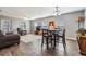 Bright and airy living room featuring an area for dining and a ceiling fan at 37850 Prairie Rose Loop, Zephyrhills, FL 33542