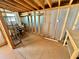 Unfinished basement with exposed framing, wood floor and natural light provides space for storage and customization at 3815 1St N Ave, St Petersburg, FL 33713