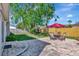 Spacious backyard featuring a brick patio with an umbrella-covered table and chairs, ideal for outdoor dining at 4711 Travertine Dr, Tampa, FL 33615