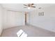 Bright bedroom with a ceiling fan, offering a comfortable space with carpet floors and natural light at 4711 Travertine Dr, Tampa, FL 33615
