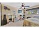 Bedroom featuring a ceiling fan, window and closet for storage at 4711 Travertine Dr, Tampa, FL 33615