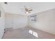 Bright bedroom with a ceiling fan, offering a comfortable space with natural light at 4711 Travertine Dr, Tampa, FL 33615