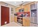 Modern kitchen with stainless steel appliances, ample cabinet space, and bright lighting at 4711 Travertine Dr, Tampa, FL 33615