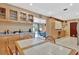 Open-concept kitchen with bright cabinetry, modern appliances, and adjacent dining area at 4711 Travertine Dr, Tampa, FL 33615