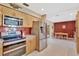 Kitchen featuring stainless steel appliances and red tile backsplash at 4711 Travertine Dr, Tampa, FL 33615