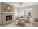 Bright living room with shiplap walls, brick fireplace, a comfortable sofa, and neutral tones at 4711 Travertine Dr, Tampa, FL 33615