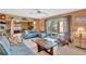 Living room with tile floor, sliding glass door and comfortable sofas at 4711 Travertine Dr, Tampa, FL 33615