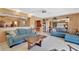 Living room featuring two sofas, tile floor, and view to the kitchen and dining room at 4711 Travertine Dr, Tampa, FL 33615