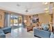 Bright living room with tile floor and sliding glass doors to the backyard at 4711 Travertine Dr, Tampa, FL 33615