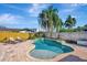 Beautifully designed pool area with brick patio, perfect for outdoor relaxation and entertainment at 4711 Travertine Dr, Tampa, FL 33615
