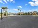 Community basketball court with palm trees near the pool and playground at 5027 Autumn Ridge Dr, Wesley Chapel, FL 33545