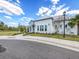 Community clubhouse with a manicured lawn and sidewalk at 5027 Autumn Ridge Dr, Wesley Chapel, FL 33545