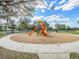 Community playground with slides and climbing equipment for outdoor activities at 5027 Autumn Ridge Dr, Wesley Chapel, FL 33545