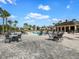 Community pool with tables and chairs for a relaxing day at 5027 Autumn Ridge Dr, Wesley Chapel, FL 33545