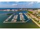Aerial view of a marina showcasing abundant boat slips, waterfront residences, and stunning ocean views at 6030 Printery St # 107, Tampa, FL 33616