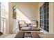 Cozy balcony featuring wicker furniture and serene outdoor views at 6030 Printery St # 107, Tampa, FL 33616