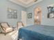 Charming bedroom with blue walls and ensuite bathroom with designer tile, great natural light at 6030 Printery St # 107, Tampa, FL 33616