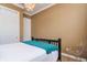 This bedroom features neutral walls, carpet, white trim, and plenty of natural light at 6030 Printery St # 107, Tampa, FL 33616