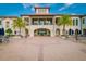 Beautiful outdoor lounge area perfect for events featuring a clubhouse, outdoor seating, and lush palms at 6030 Printery St # 107, Tampa, FL 33616