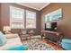 Cozy living room features a modern tv, decorative rug, and lots of natural light at 6030 Printery St # 107, Tampa, FL 33616