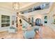 Spacious two-story entry lobby with lots of natural light, comfortable seating, and a gorgeous staircase at 6030 Printery St # 107, Tampa, FL 33616