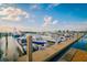 Wide shot of boat docks at a marina under bright blue skies and fluffy white clouds at 6030 Printery St # 107, Tampa, FL 33616
