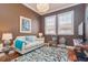 Cozy sitting room with modern lighting, wood floors, and comfortable seating area, and neutral decor at 6030 Printery St # 107, Tampa, FL 33616