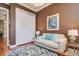 Comfortable sitting room with modern decor, closet and ample natural light at 6030 Printery St # 107, Tampa, FL 33616