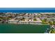 Aerial view of the building complex along the waterfront, with easy access to the beach and waterway at 6061 2Nd E St # 56, St Pete Beach, FL 33706