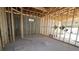 Framed basement featuring concrete flooring, wooden studs and block walls awaiting finishing at 7438 Burlington Ave, St Petersburg, FL 33710