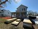 New construction of a two-story home featuring a covered porch and construction materials on the front lawn at 7438 Burlington Ave, St Petersburg, FL 33710