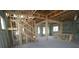 Interior framing of a new home with open staircase and natural light streaming through the windows at 7438 Burlington Ave, St Petersburg, FL 33710